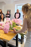 Brides-to-be learning together at the workshop table