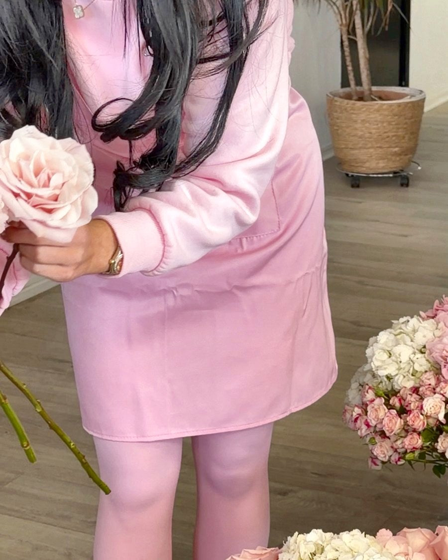 Lifting a pink rose to add to a bouquet
