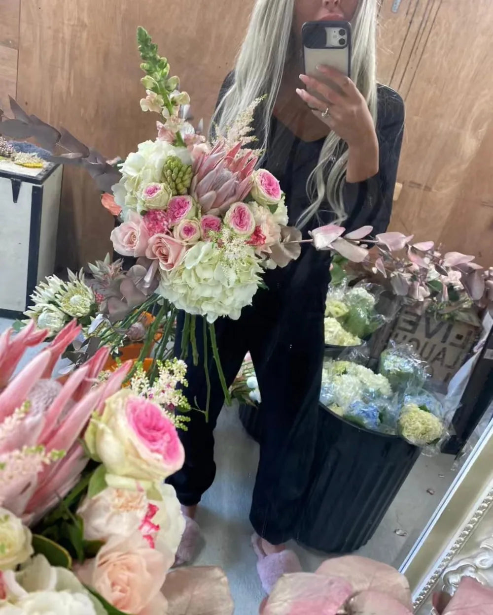 Kristina holding one of her large hand tied bouquets