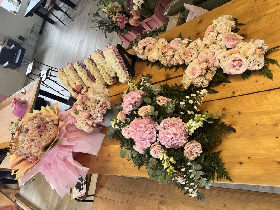 Funeral sprays and tributes laid out on the studio tables